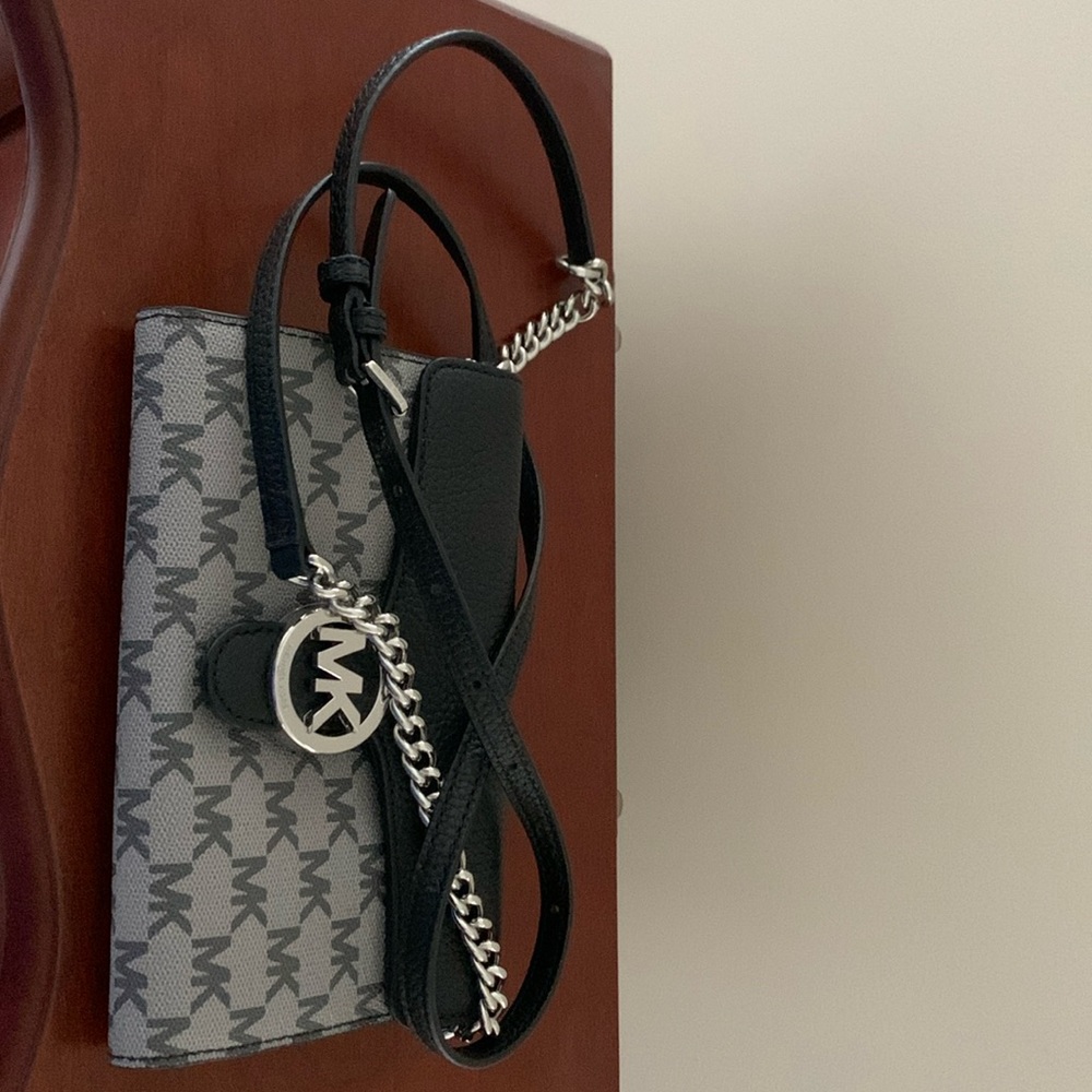 Michael Kors crossbody with snap closure